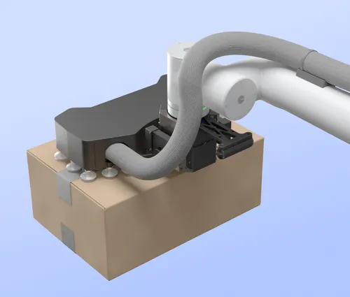Robotic arm with suction cups gripping a sealed cardboard box.