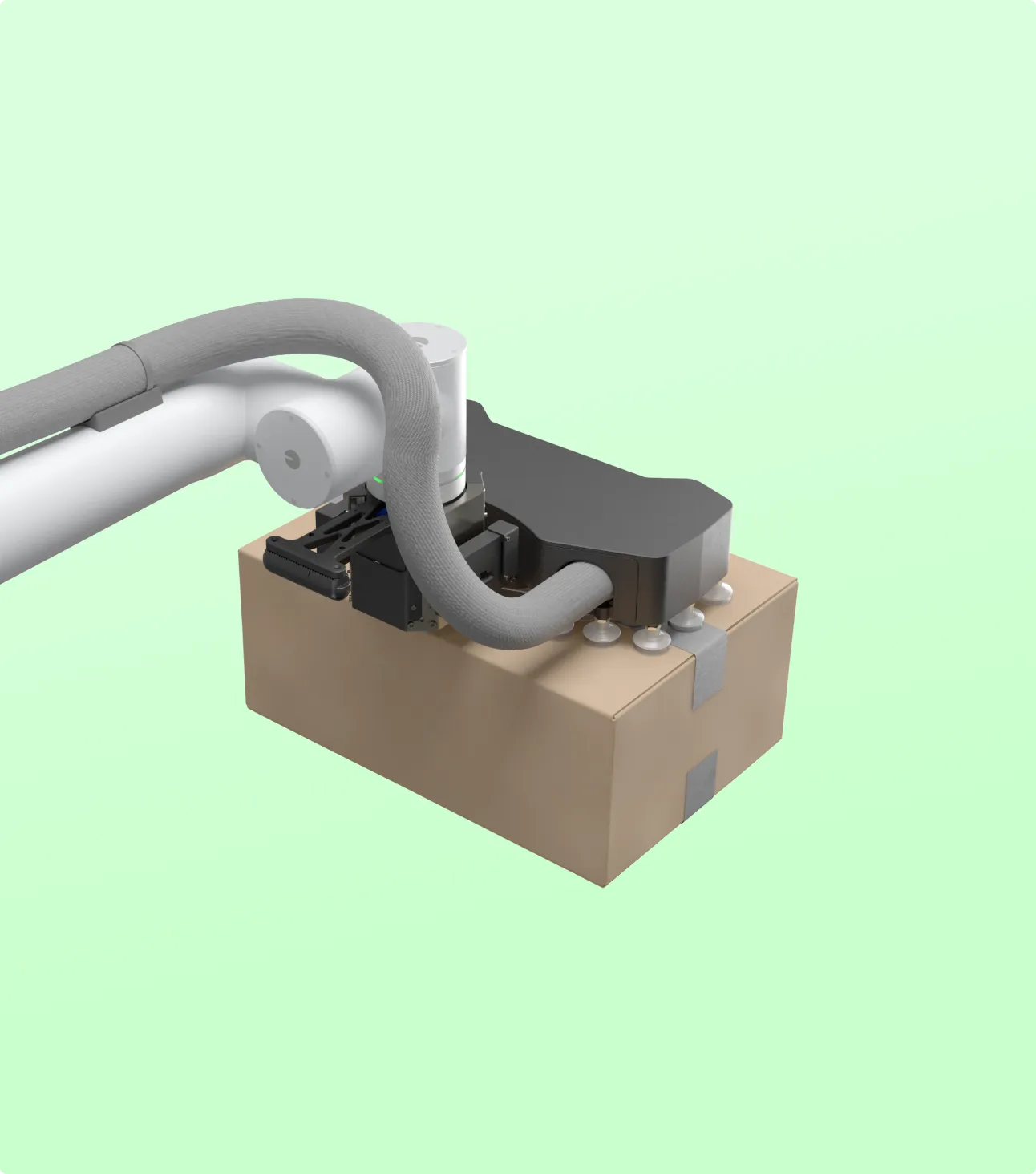 Robotic arm equipped with a black suction device lifting a cardboard box with duct tape on a light green background.