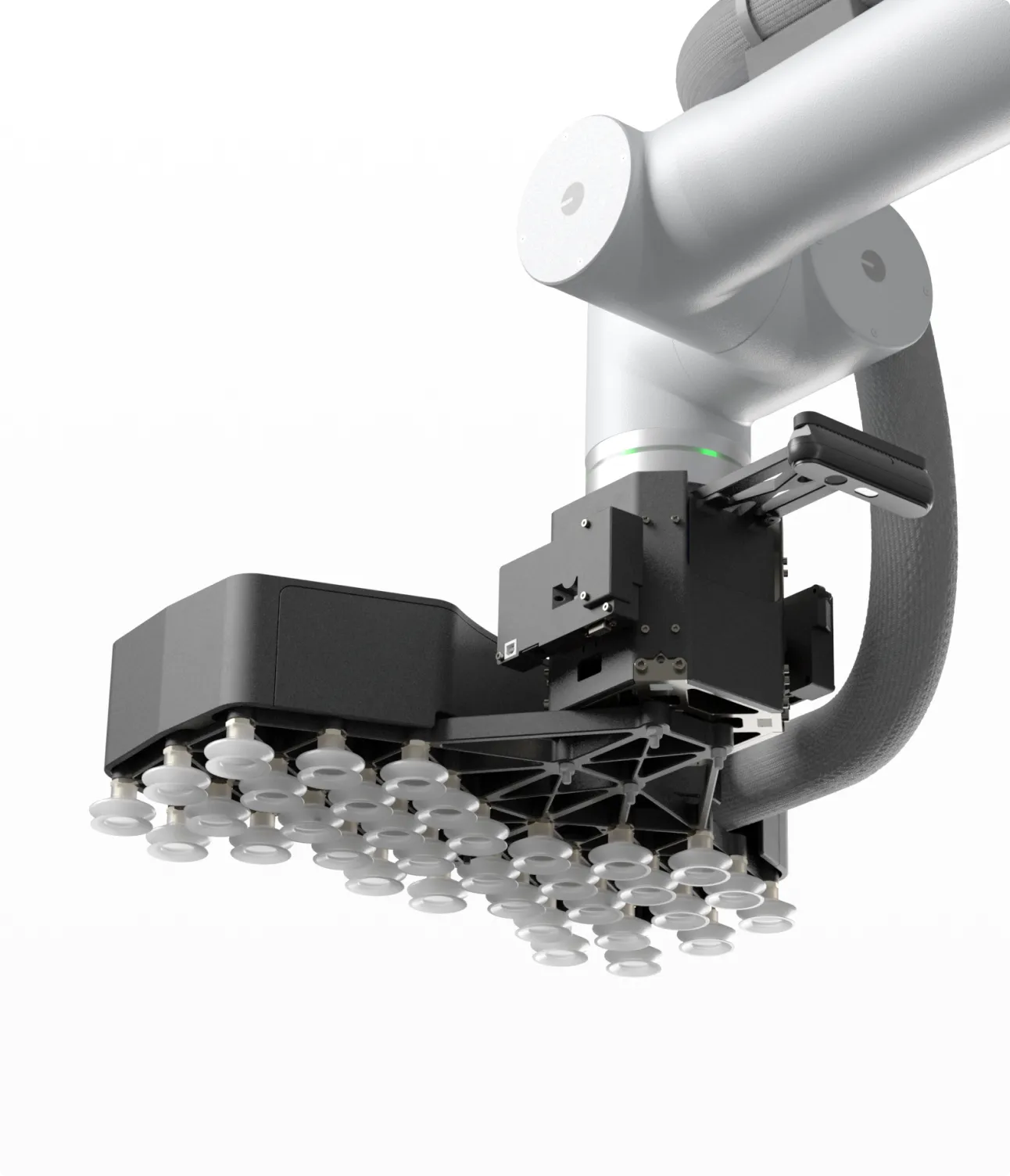 Close-up of a robotic arm equipped with multiple suction cups on a black mount for handling objects.