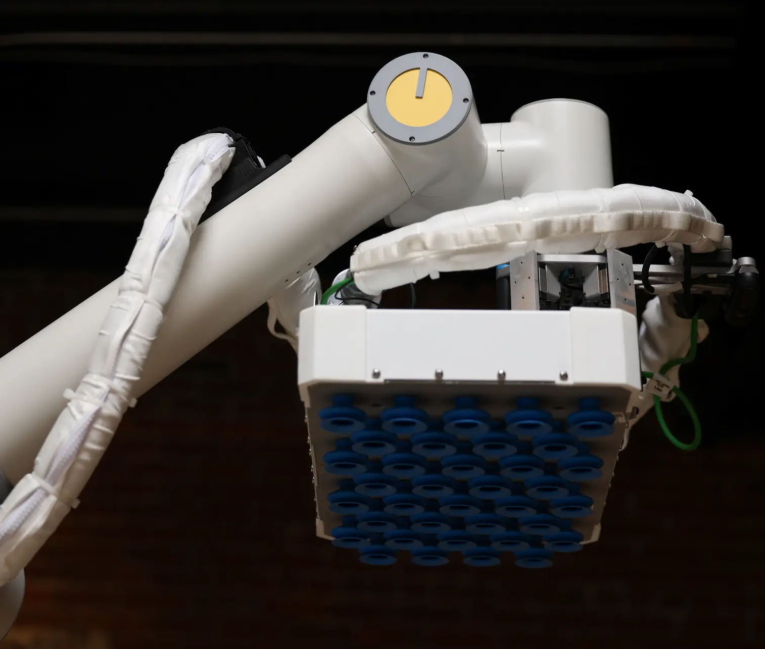 Cassie's end of arm tool, a software-controlled array of cups for multi-picking with on-board vacuum.