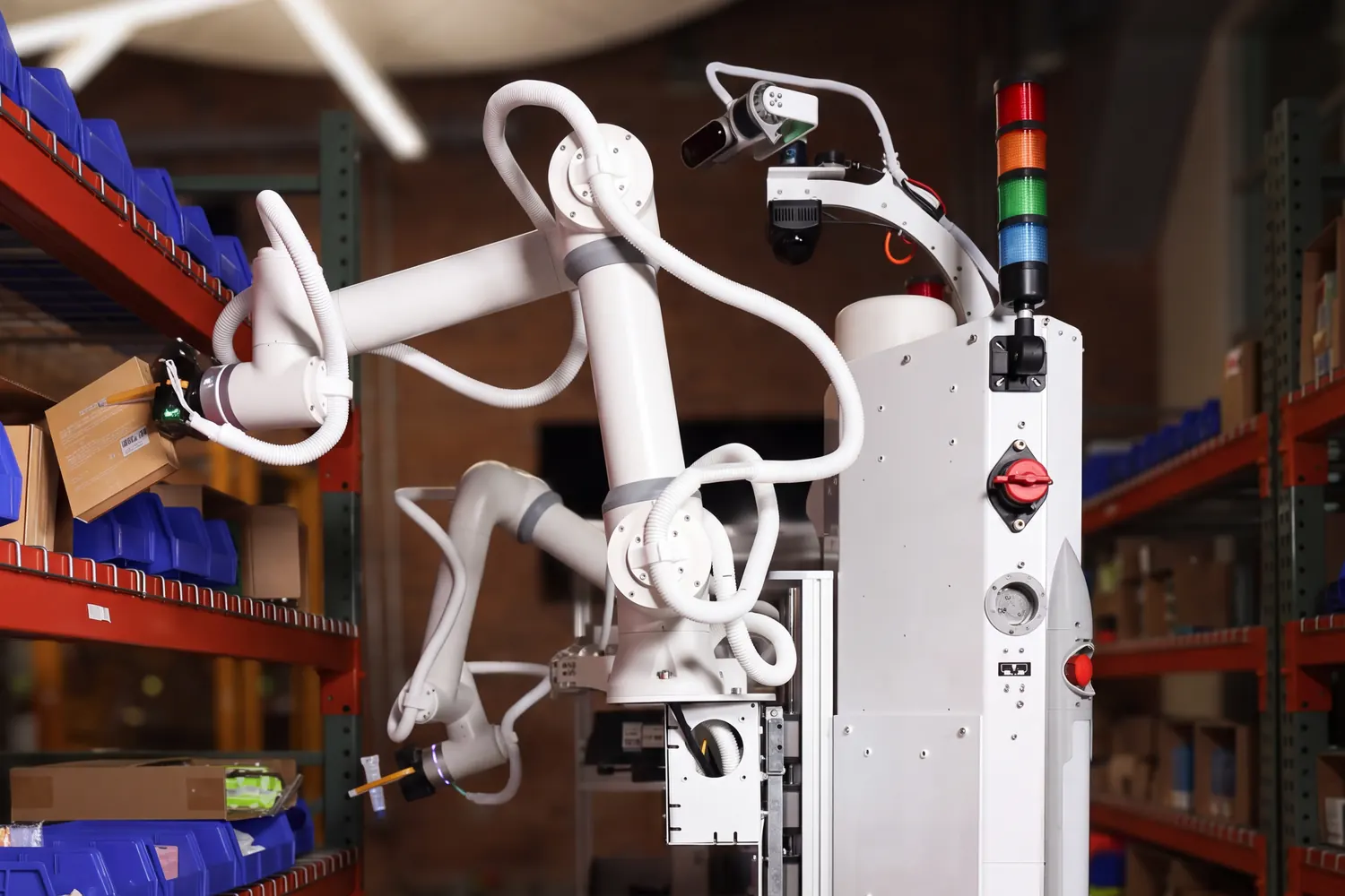 Tutor robot Sonny picking items from warehouse shelving with both arms, flanked by bins of retail inventory.