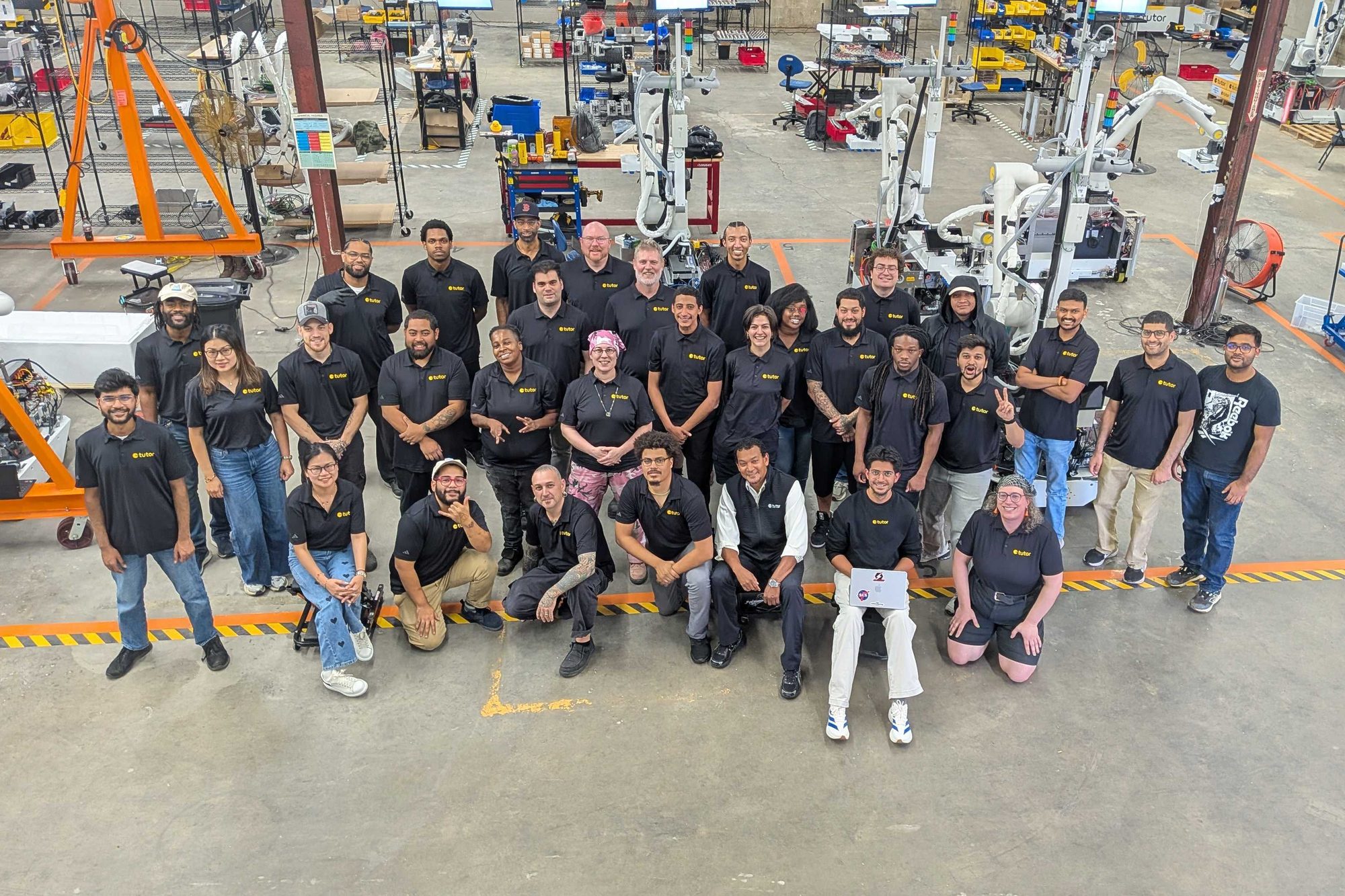The Tutor Intelligence manufacturing team on the factory floor