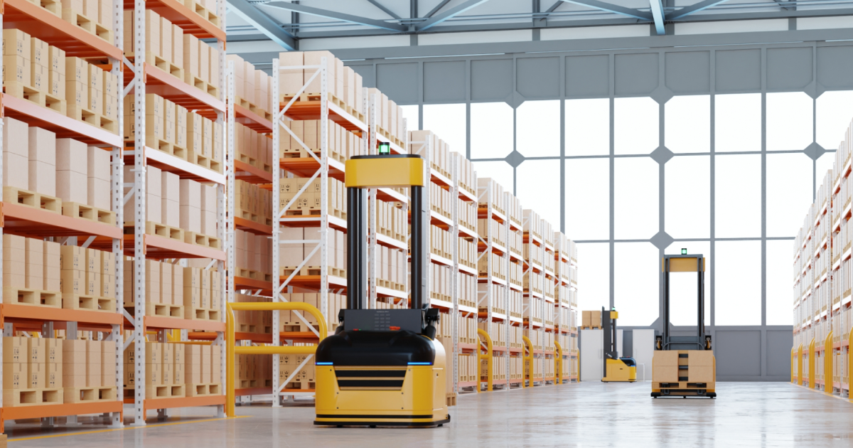 autonomous forklifts moving between tall warehouse shelves filled with boxes