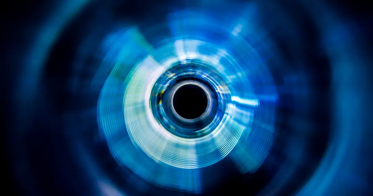 abstract blue circular motion resembling a spinning lens or tunnel