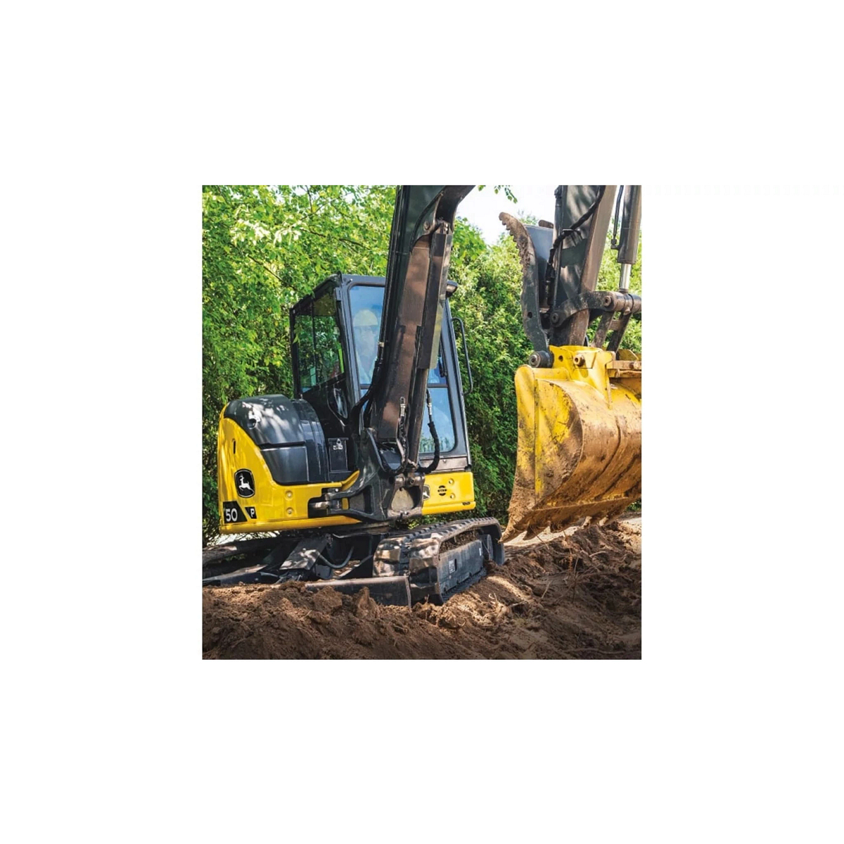 A 50P-Tier Excavator moving dirt with trees in the background