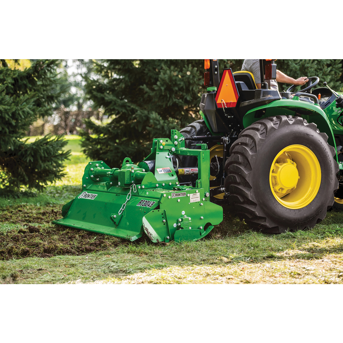 Side view of the RT3049 Rotary Tiller working up ground