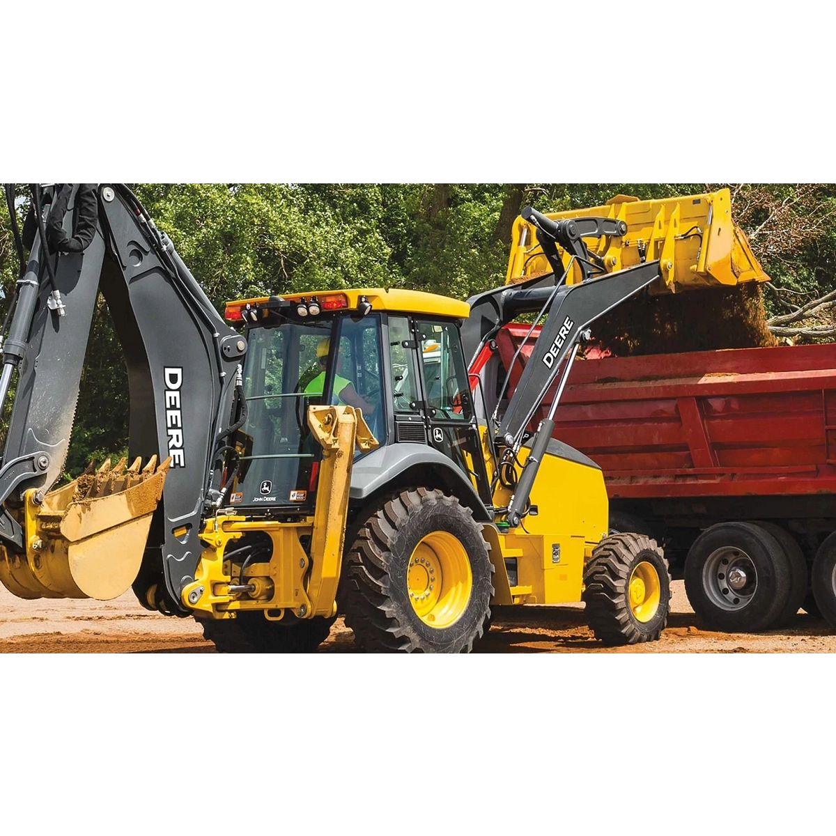 A 710 P-Tier Backhoe dumping dirt into a dump truck