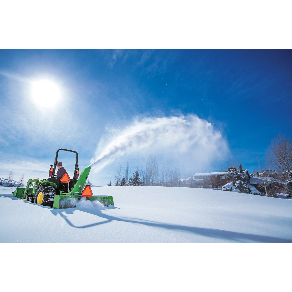 Blowing snow using a SB1154 Snowblower on 2025R Tractor