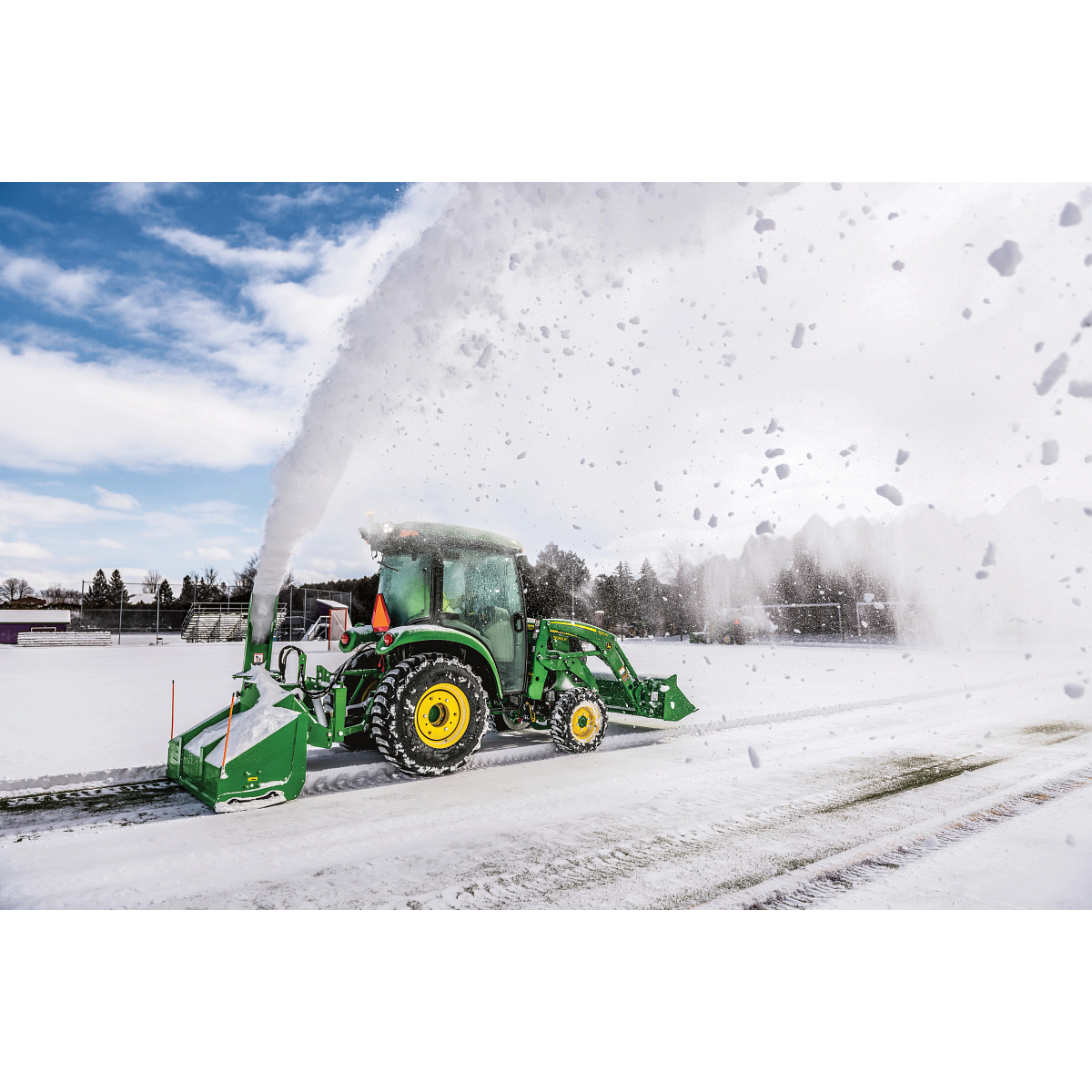 Blowing snow using a SB1164P Snowblower on 3046R Tractor in parking log
