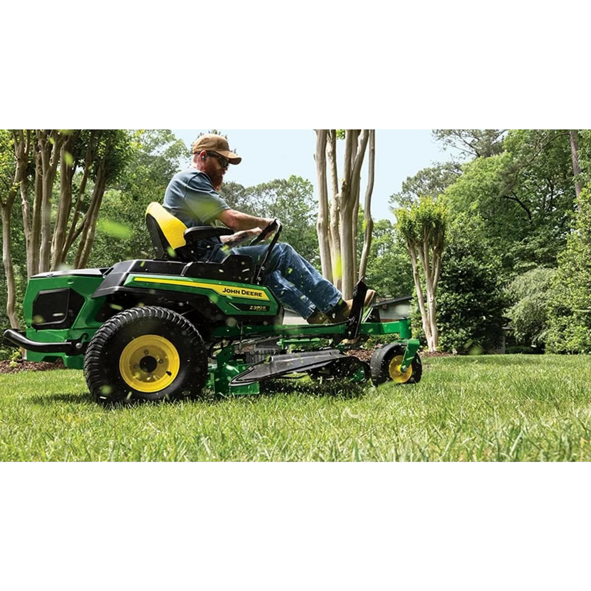 Landscaper mowing with a Z380R Electric ZTrak Mower around trees