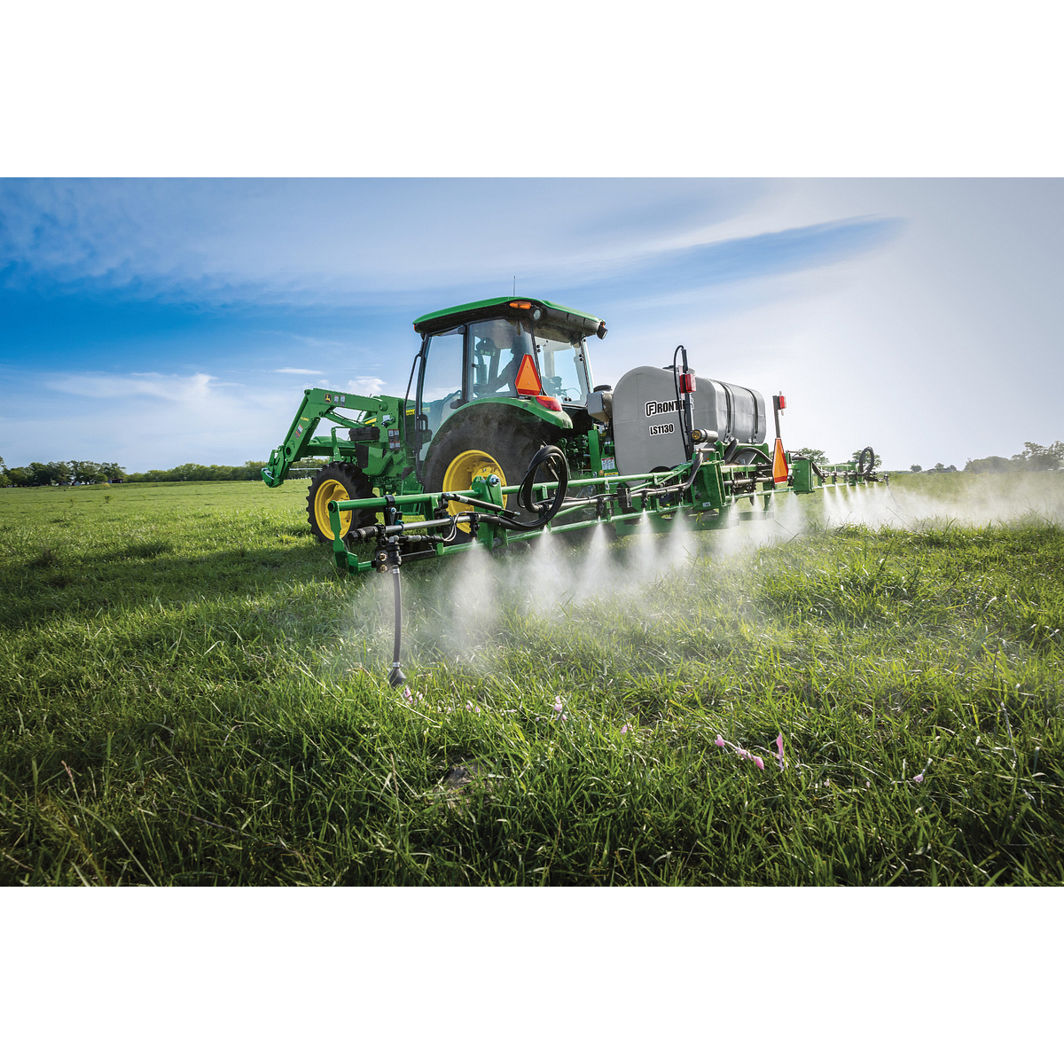 Field view of LS1130 Sprayer on 5075E Tractor in field