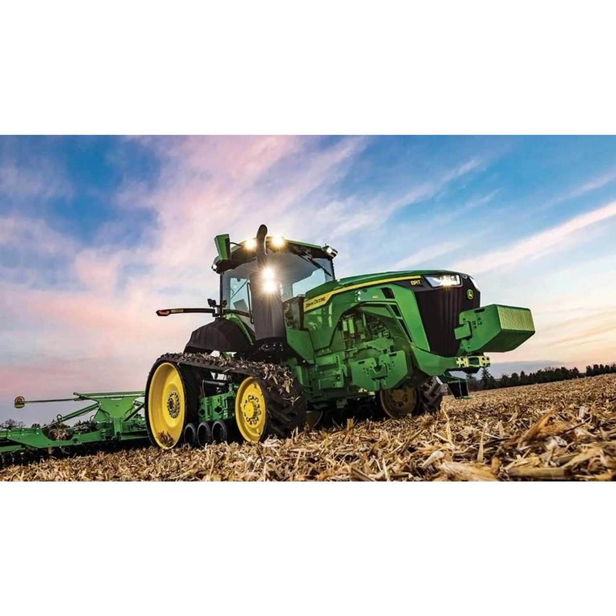 8RT 410 Two-Track Tractor with a tillage attachment in a harvested corn field