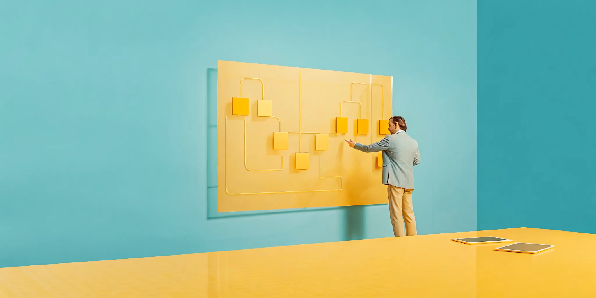 Project management consultant developing a strategic plan on a flowchart board.