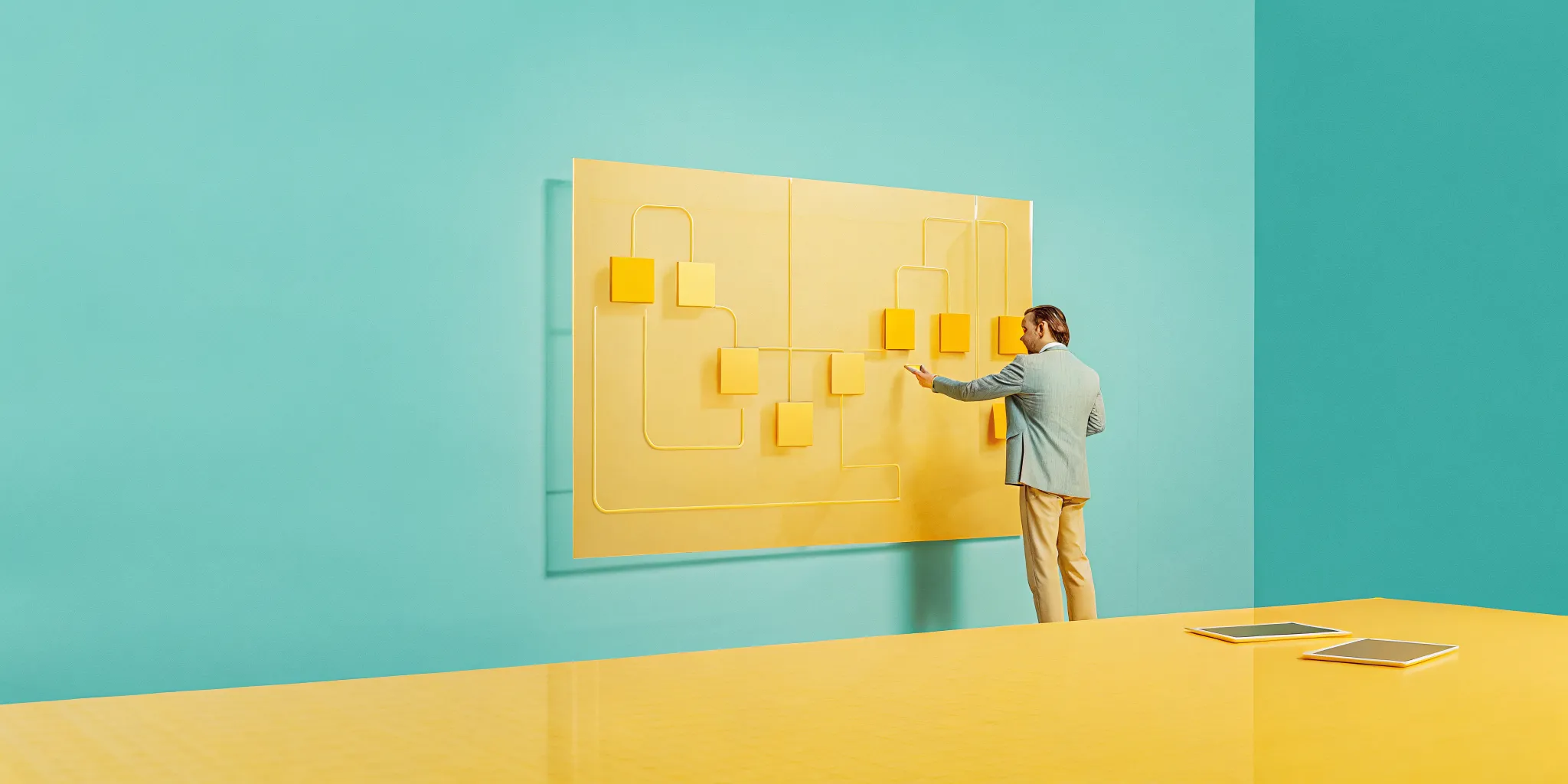 Project management consultant developing a strategic plan on a flowchart board.