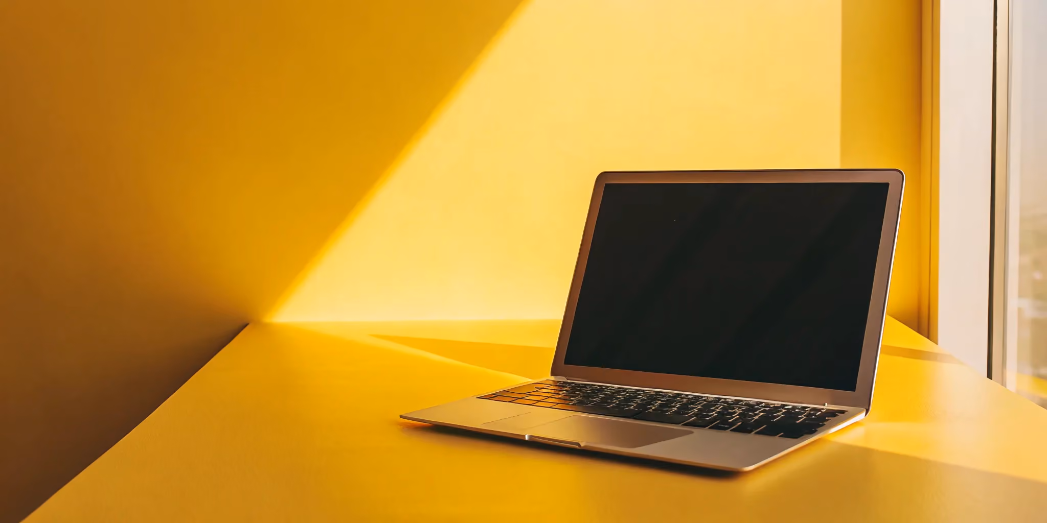 Planning a merger with an M&A integration checklist on a laptop.