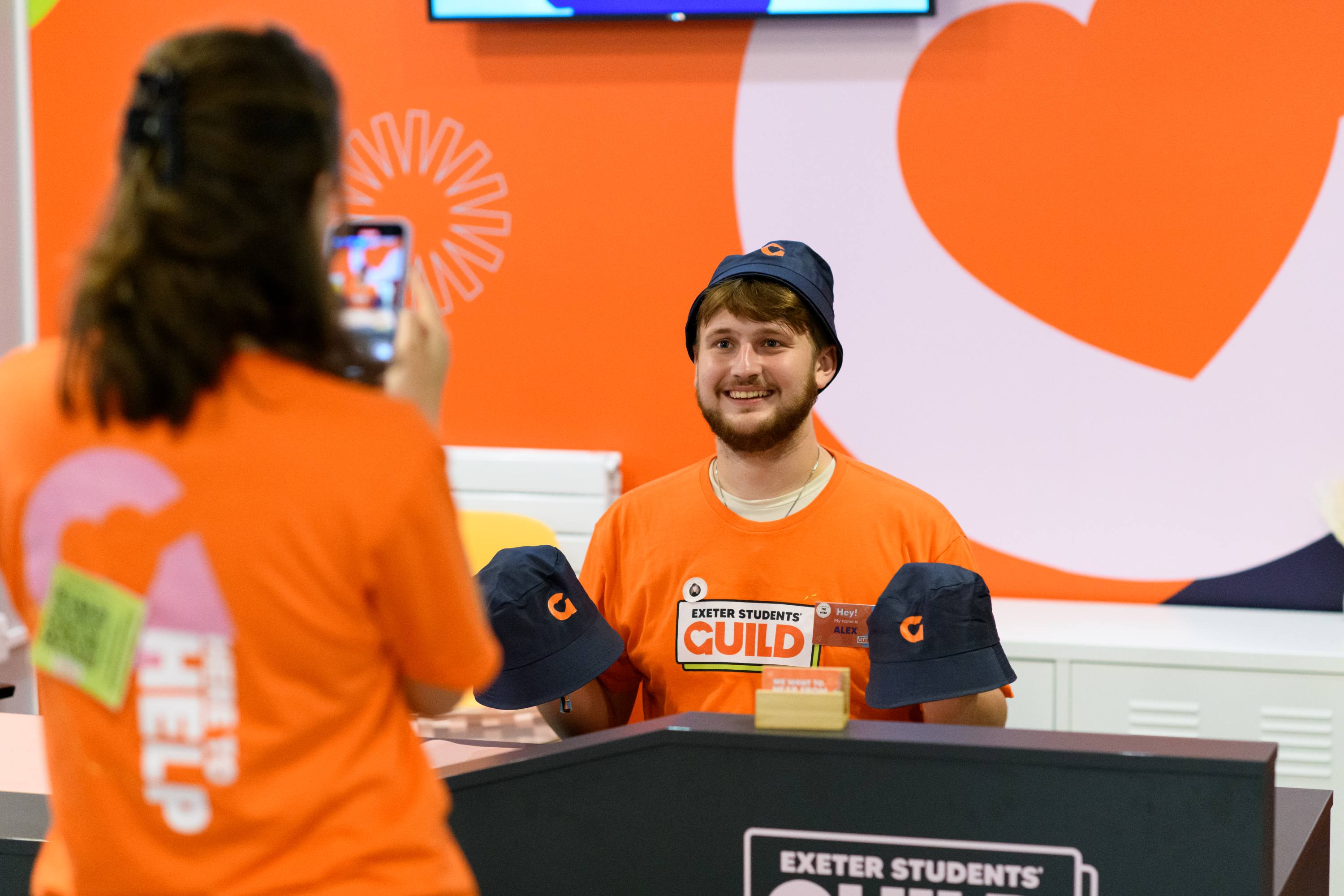 A student smiling at reception