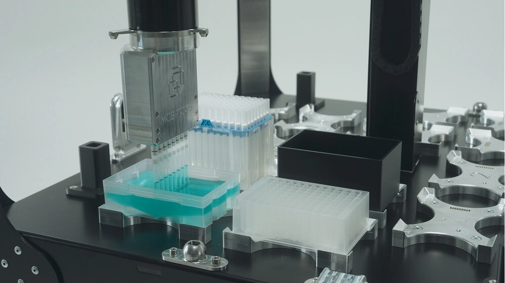 Pipette tips, sample trays, and labware arranged on the Trilobot One.