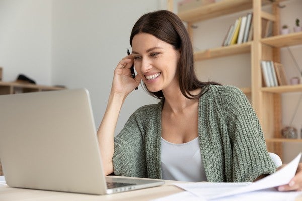 Woman looking at her laptop computer screen.