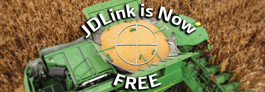 Top view of a green combine harvester filled with harvested corn in a field, with text reading 'JDLink is Now FREE'.