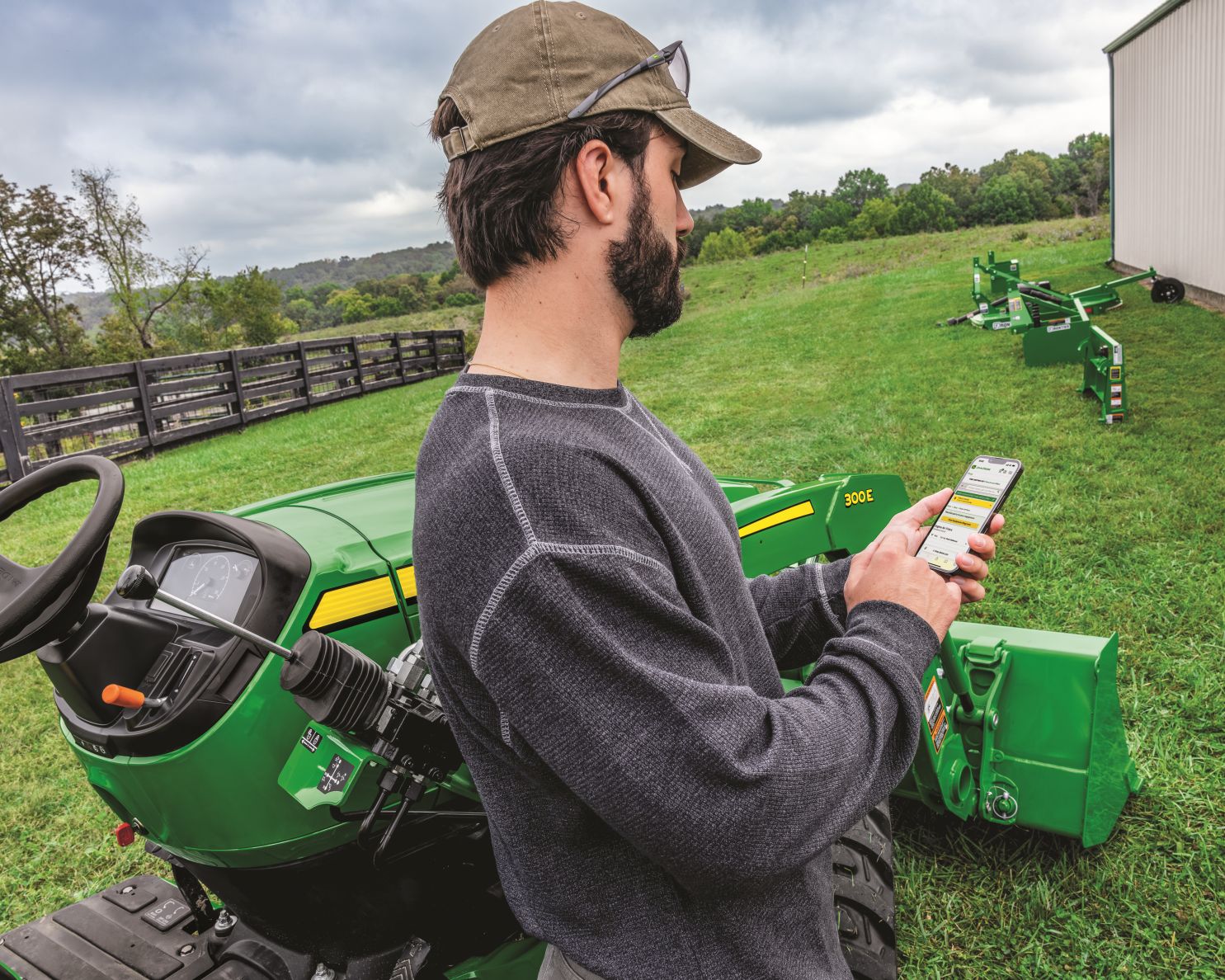 Man using Equipment Mobile while in field.