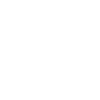 Silhouettes of people in front of a tall office building
