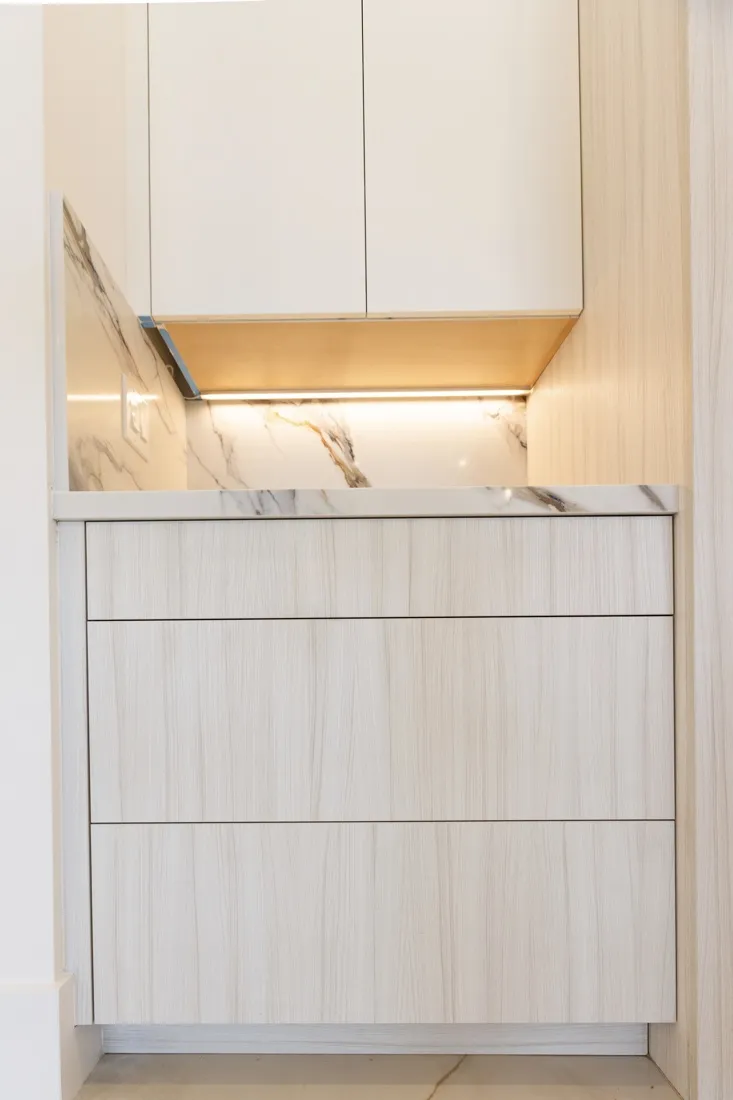 Custom kitchen cabinetry with elegant design and warm atmosphere