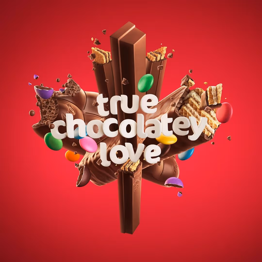 Variety of KitKat chocolate bars with colorful candy pieces on a red background and text 'true chocolatey love'.
