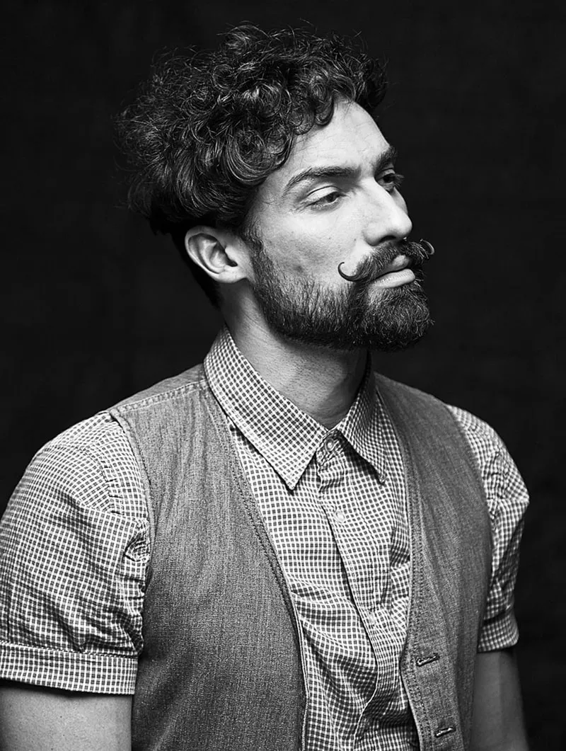 This timeless portrait photograph captures the subject’s personality with a perfect balance of light, shadow, and expression, bringing their character to life