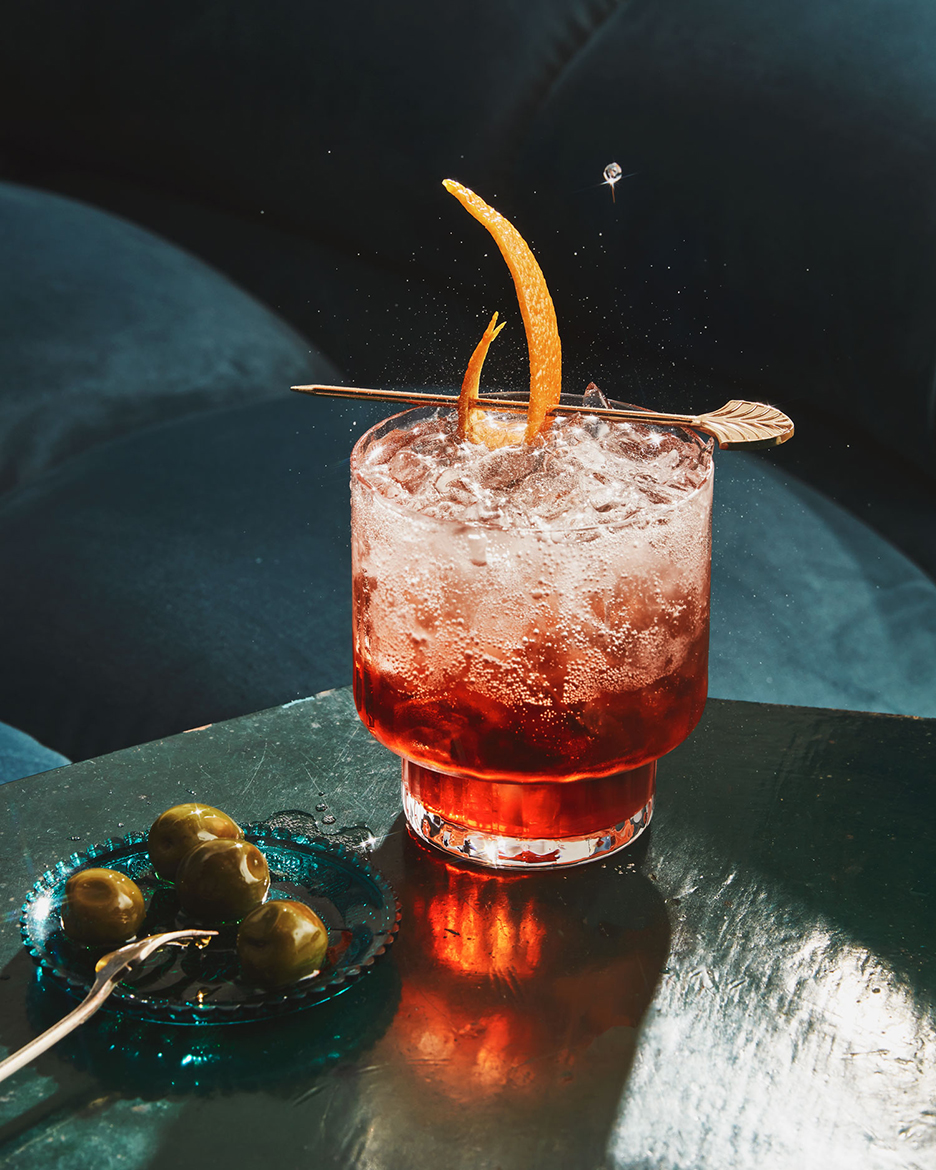 A refreshing drink photograph that captures the perfect blend of colors and textures, expertly lit to showcase every droplet and bubble