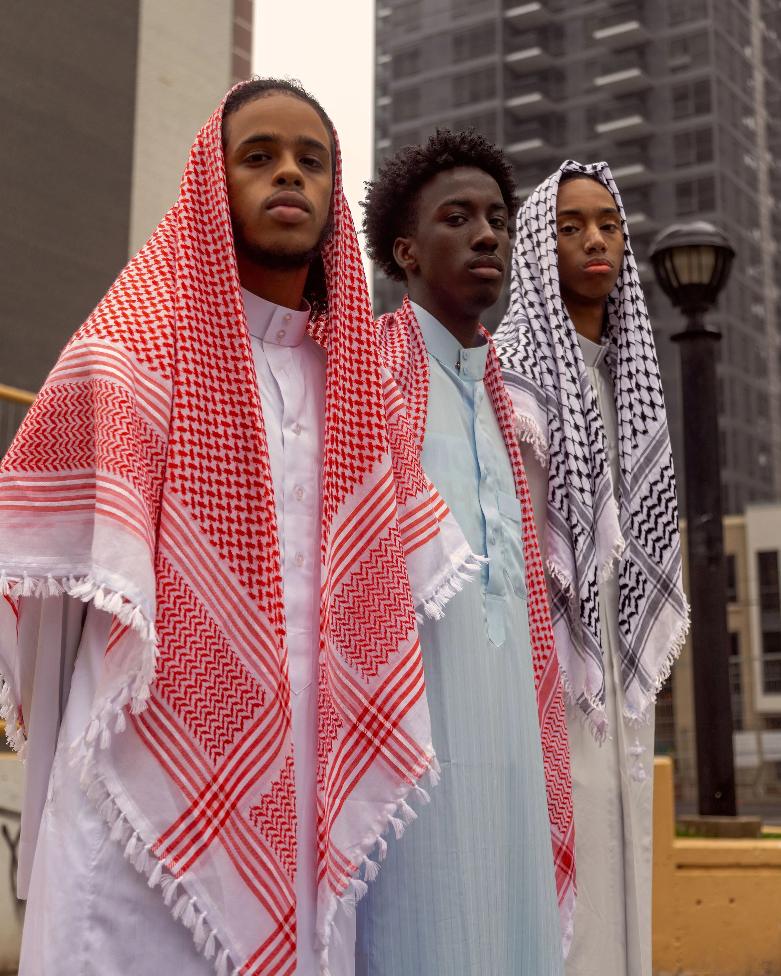 three man photographed on a basketball court by fashion photographer