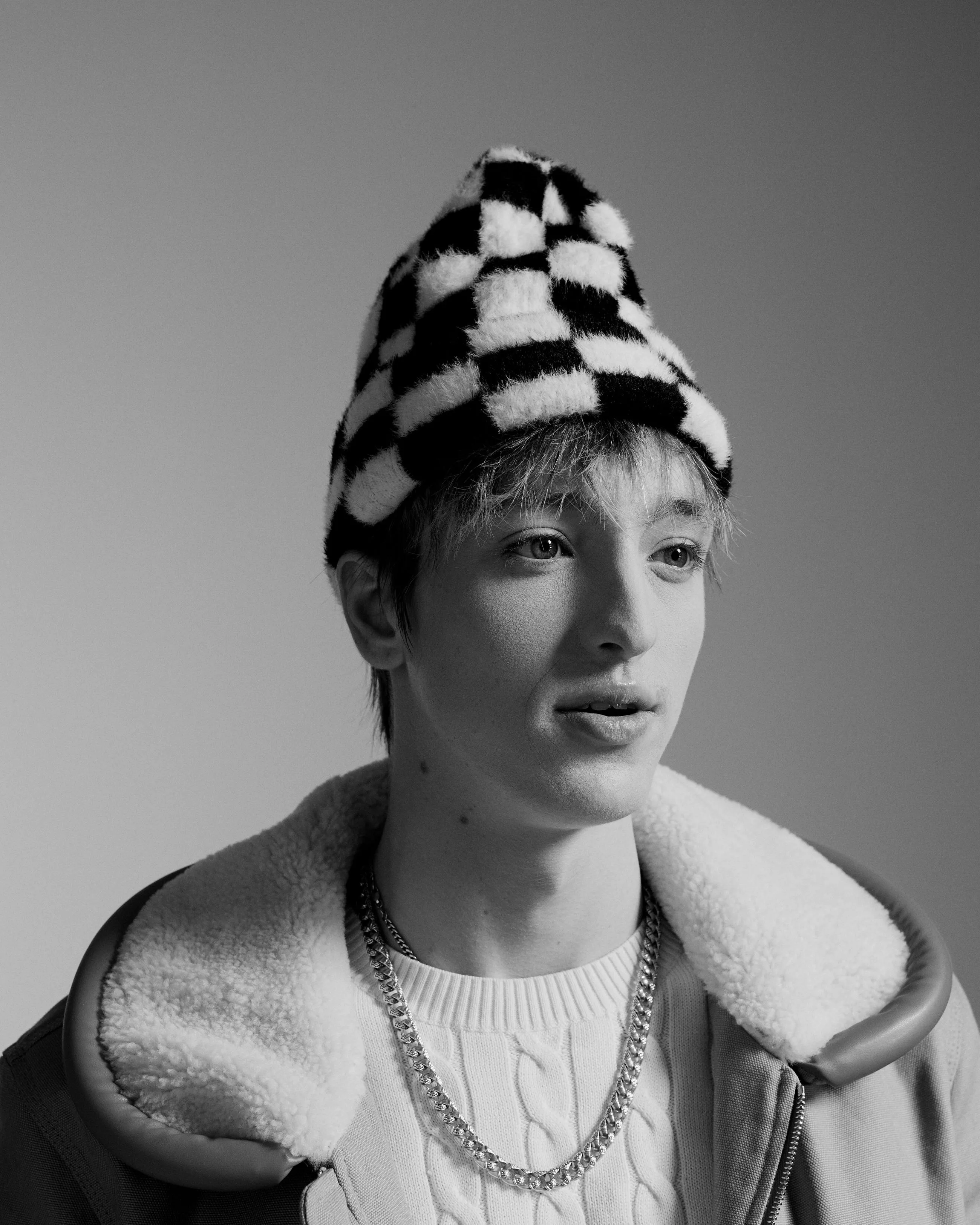 This timeless portrait photograph captures the subject’s personality with a perfect balance of light, shadow, and expression, bringing their character to life