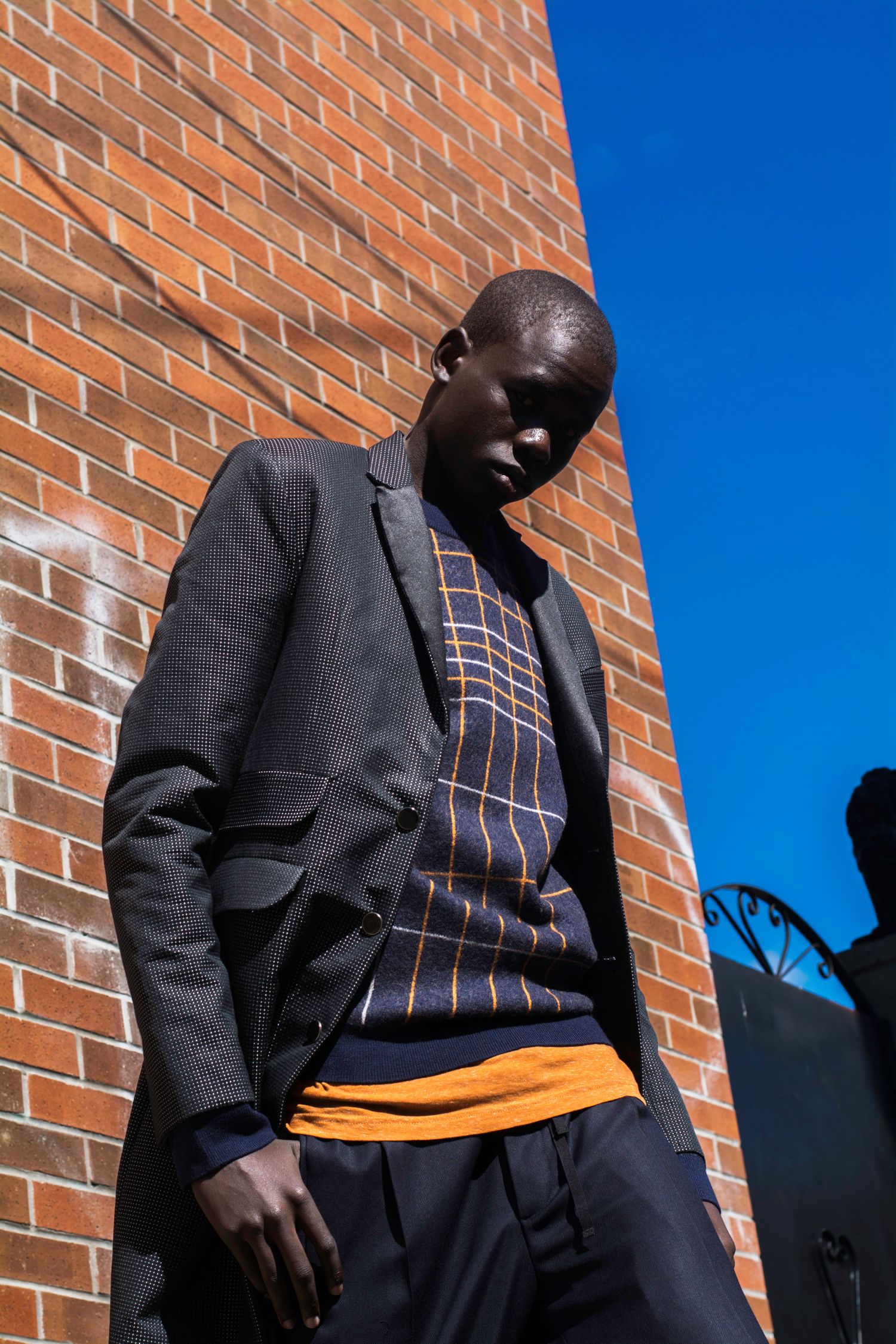 Male model photographed in casual formal dress on the street
