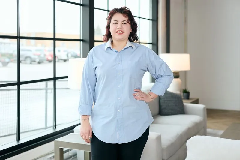 This striking portrait photograph showcases the subject in a natural, yet artistic light, emphasizing their features and creating a connection with the viewer.