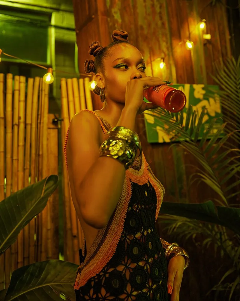 Editorial photographer jamaican restaurant with a model inside