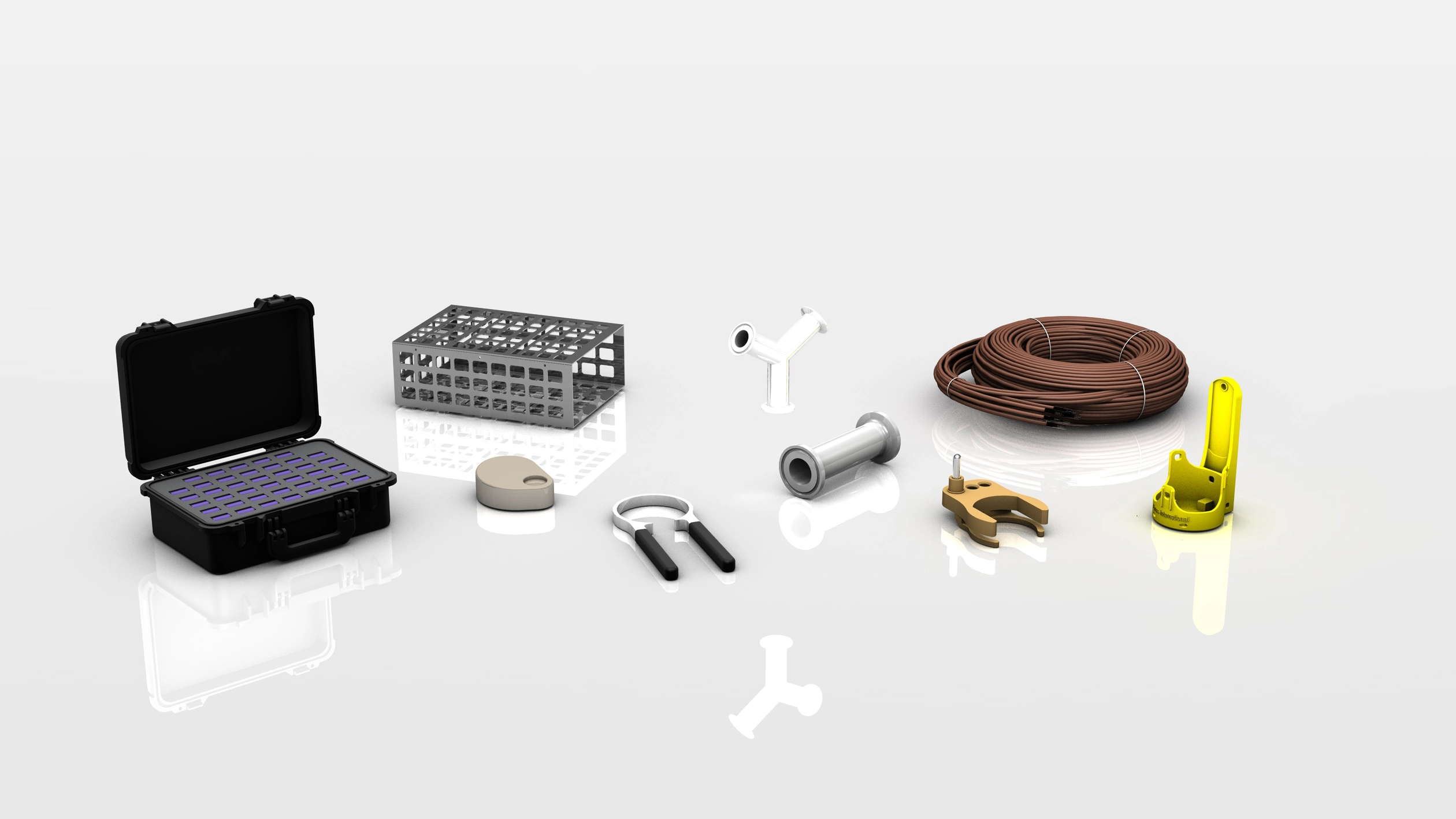 Various industrial accessories including an open black case with purple inserts, a metal cage, a small beige device, a silver tool with black handles, white and silver fittings, a brown coiled cable, a brass clamp, and a yellow mounting bracket.