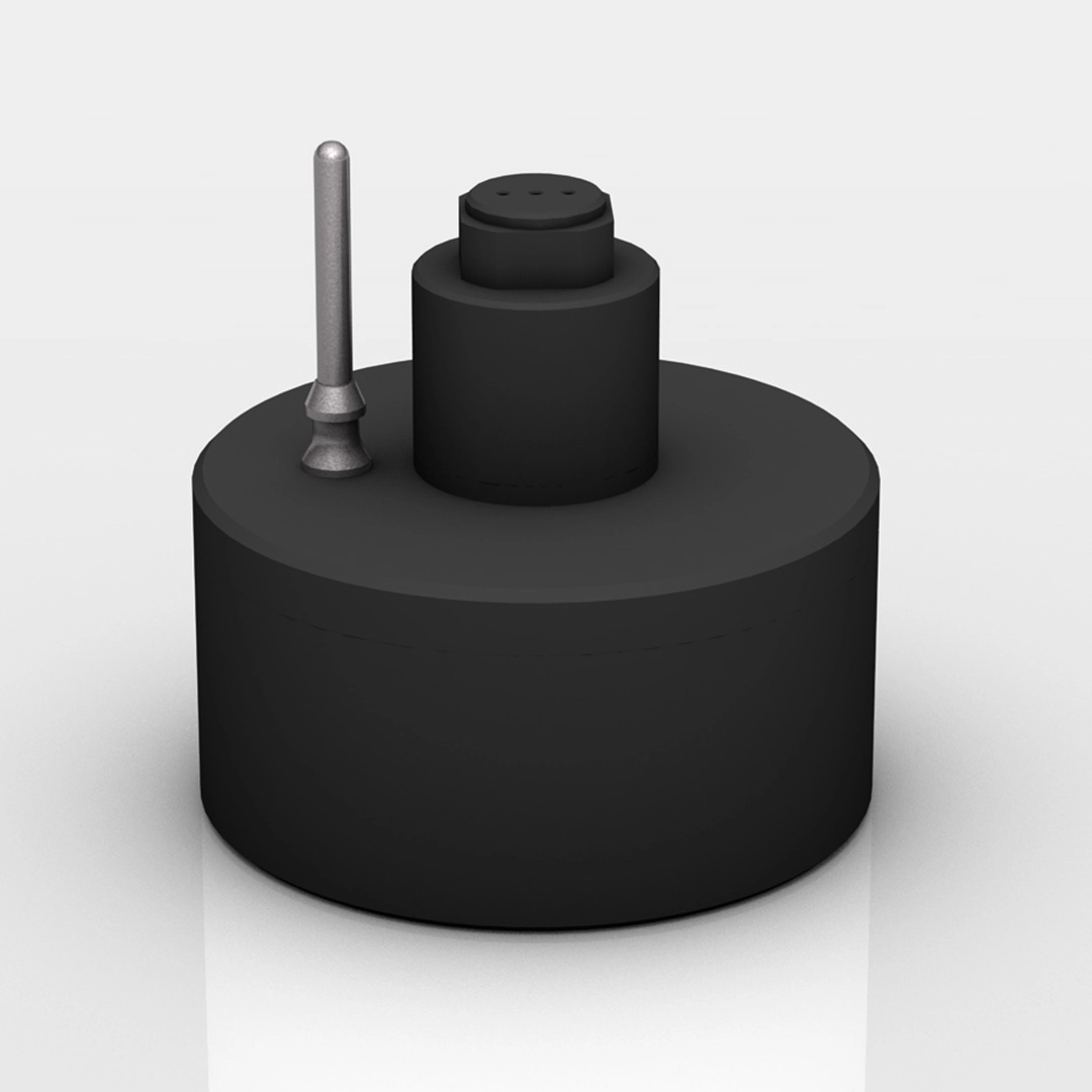 Black cylindrical device with a vertical silver antenna and a round top connector.
