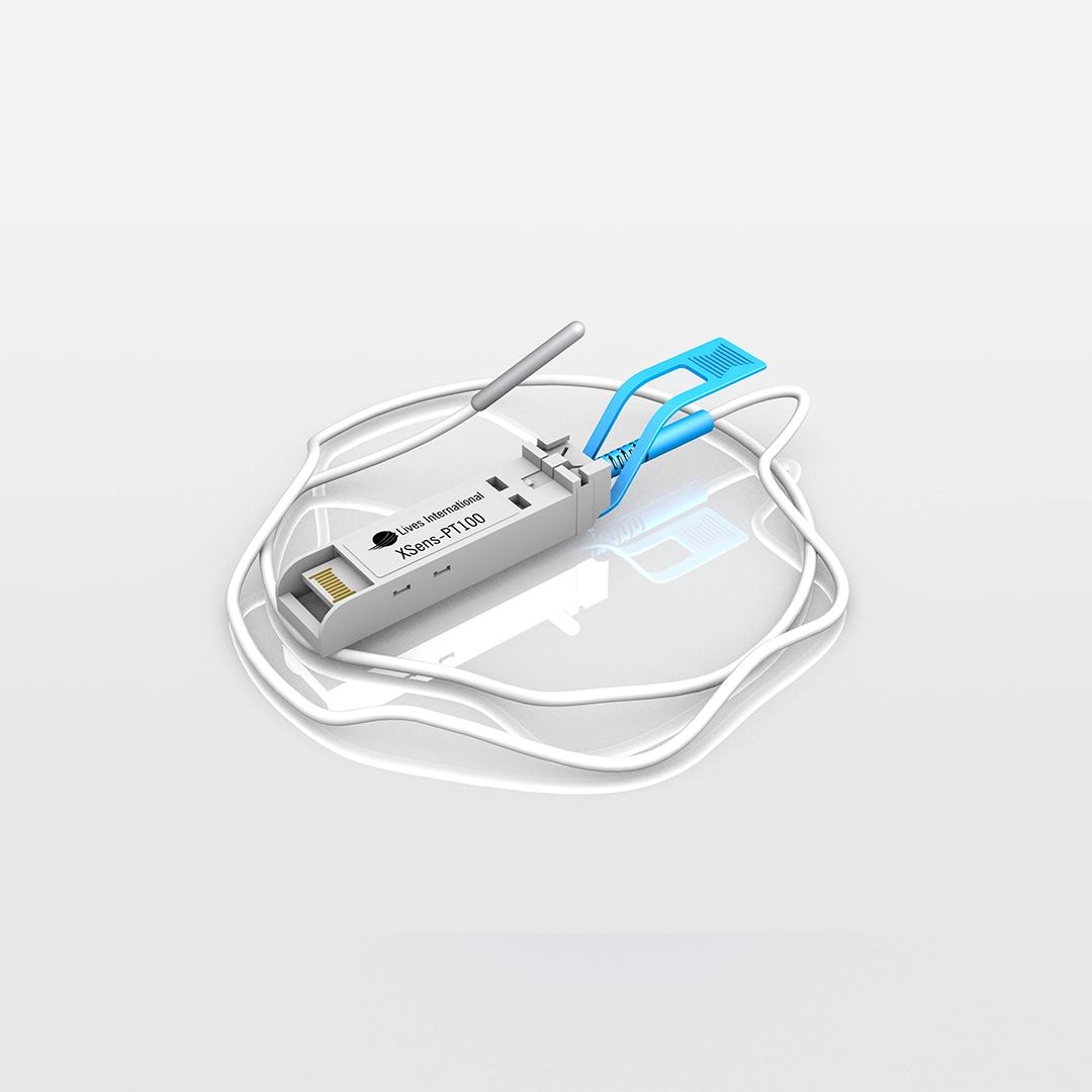 Close-up of a Lives International Xsens-PT100 sensor device with attached white cable and a blue clip on a reflective white surface.