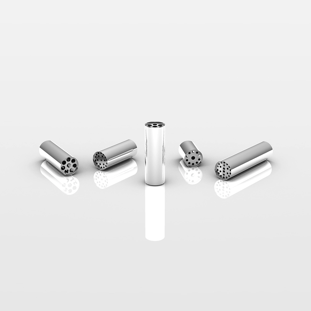 Five shiny cylindrical metal inserts with different hole patterns arranged on a reflective white surface.