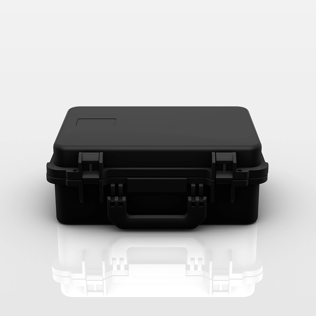 Closed black hard-shell carrying case with handle and secure latches on a reflective white surface.