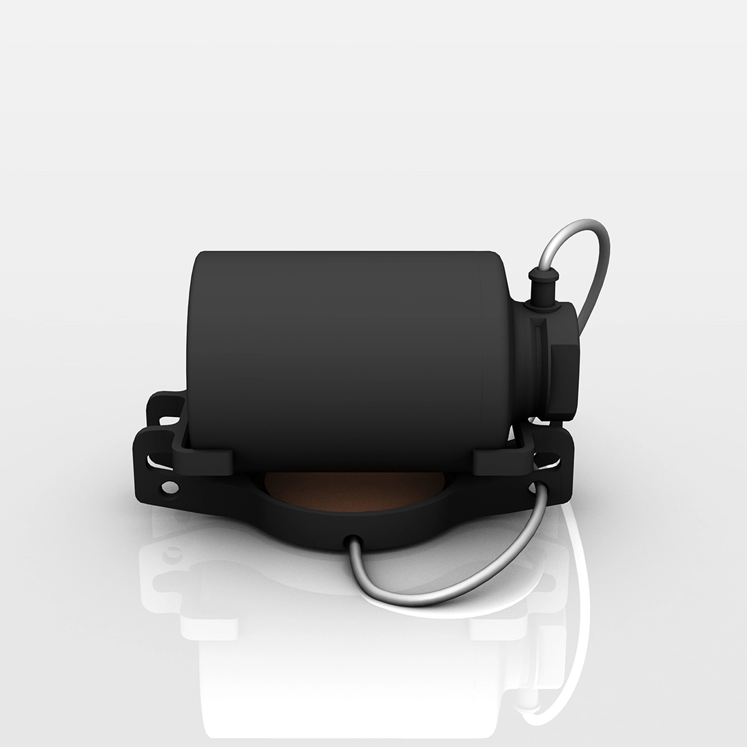 Black cylindrical electronic device with metal bracket and attached wire on a reflective white surface.