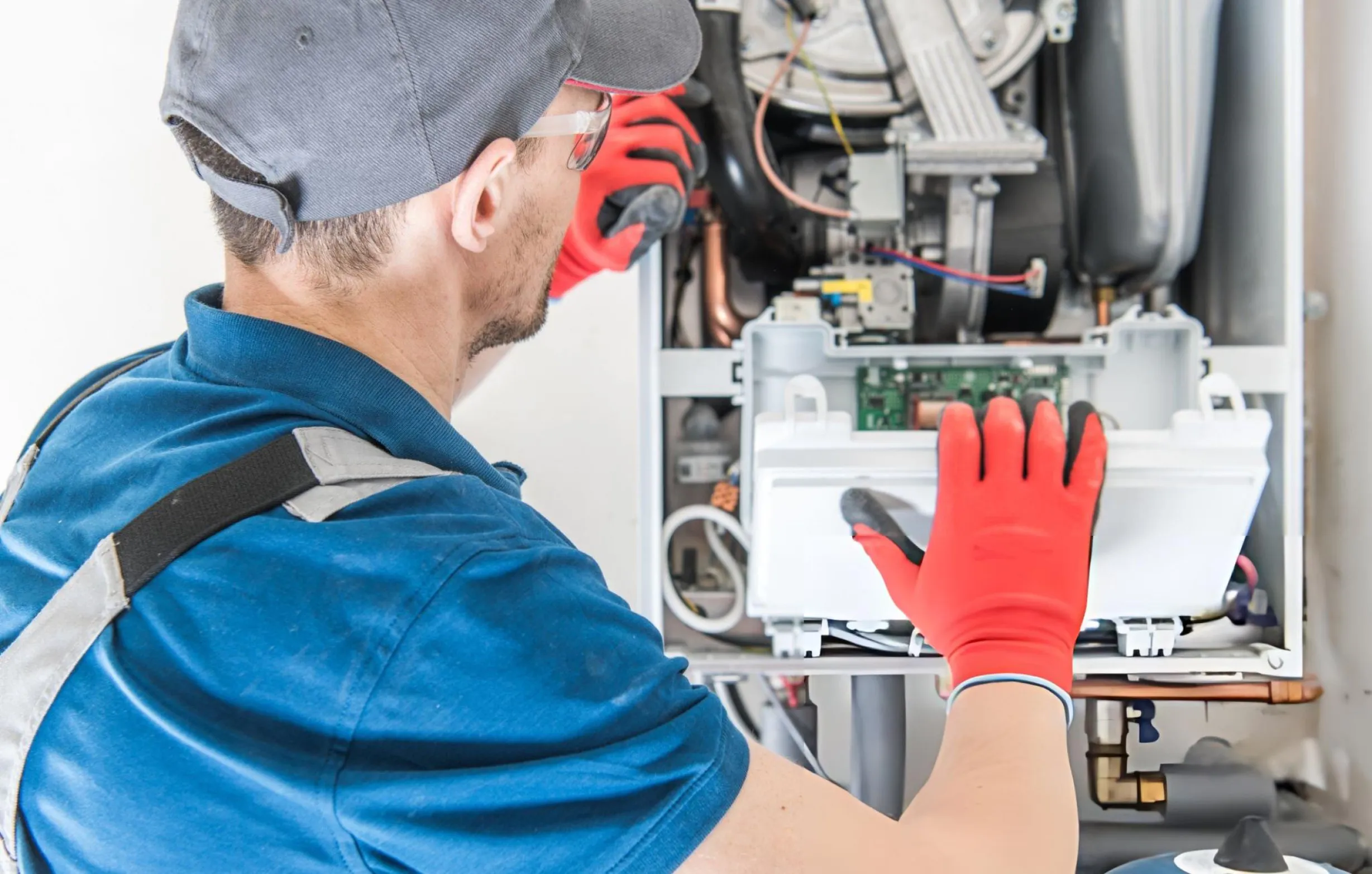Technician installing a new energy-efficient furnace system for a Texas home