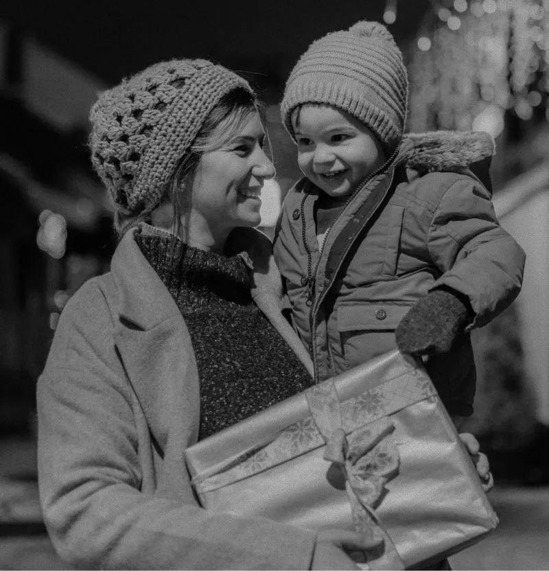 Survivor finding safety and comfort with child at The Archway shelter