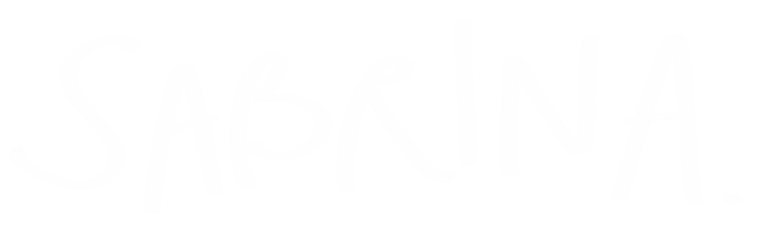 Handwritten white text on black background spelling 'SABRINA.'