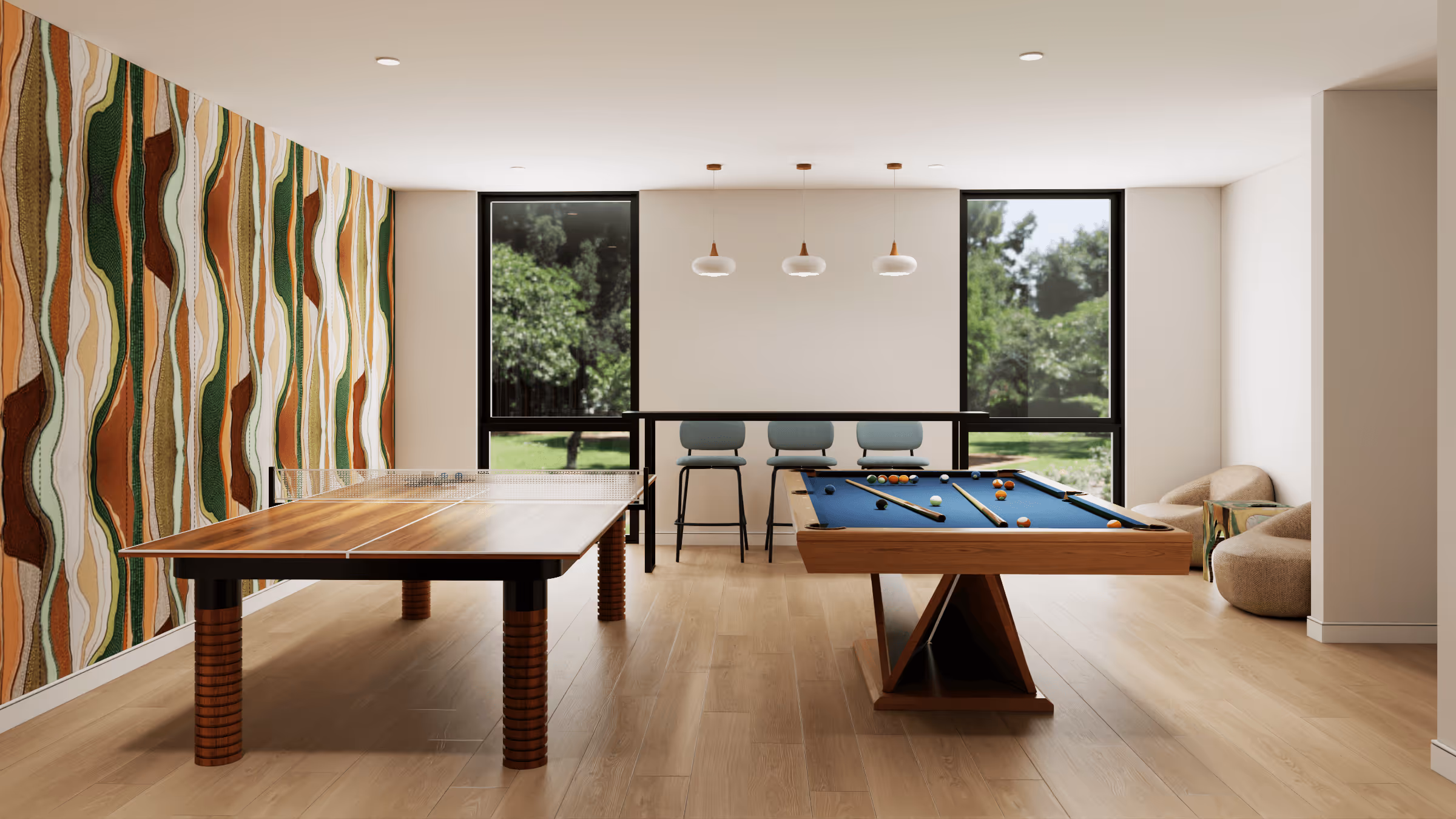 Modern game room with wooden ping pong table, blue pool table, three bar stools, and colorful abstract wall art.