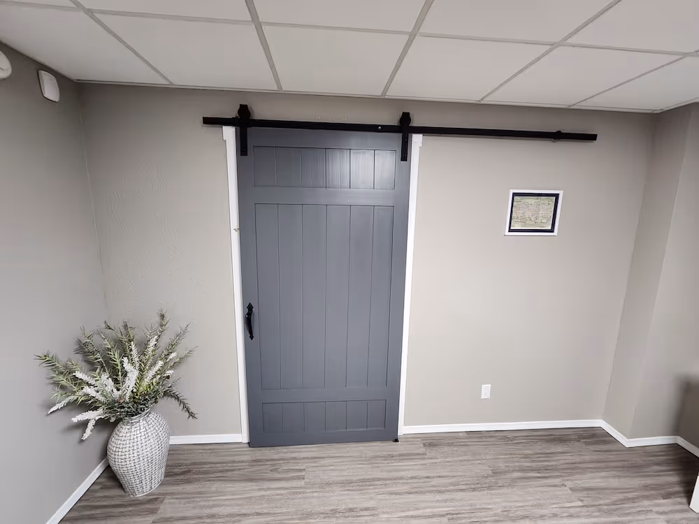 room with a grey door with fresh coat of paint
