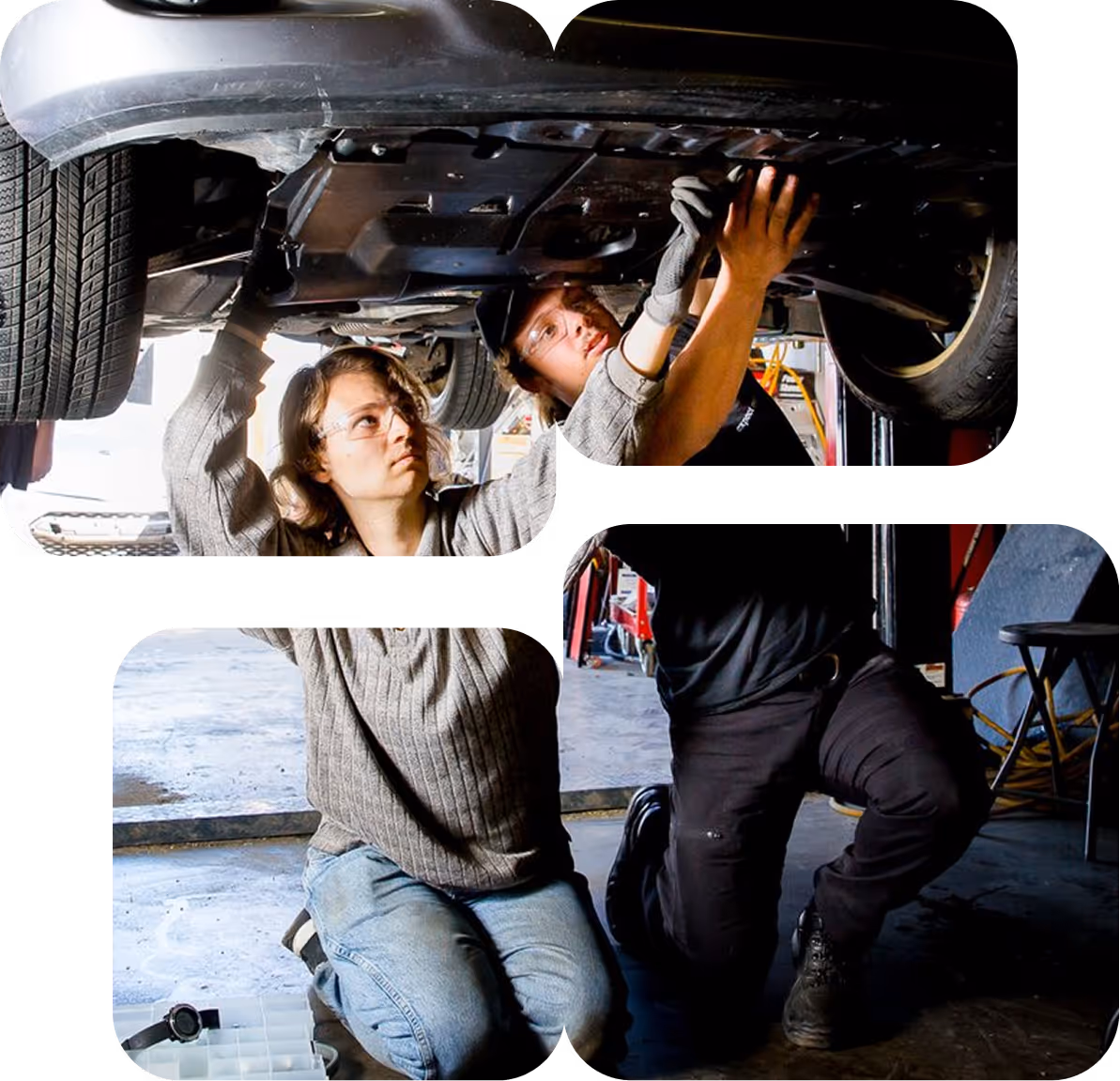 Two mechanics wearing safety glasses working together under a lifted car in a garage.