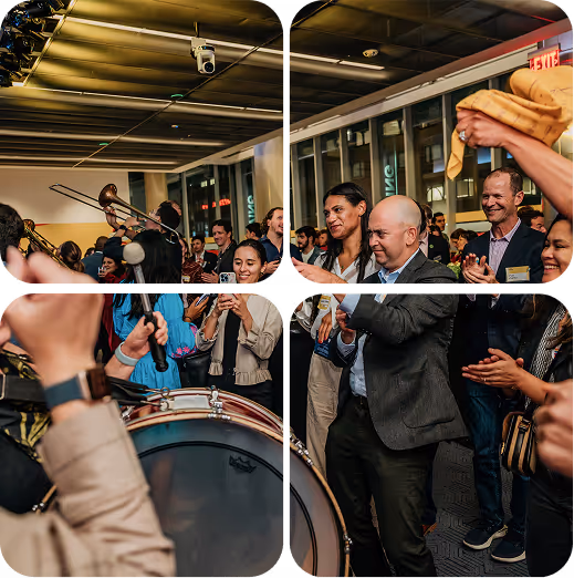 People enjoying live music at an indoor event with a drum and trombone player performing.