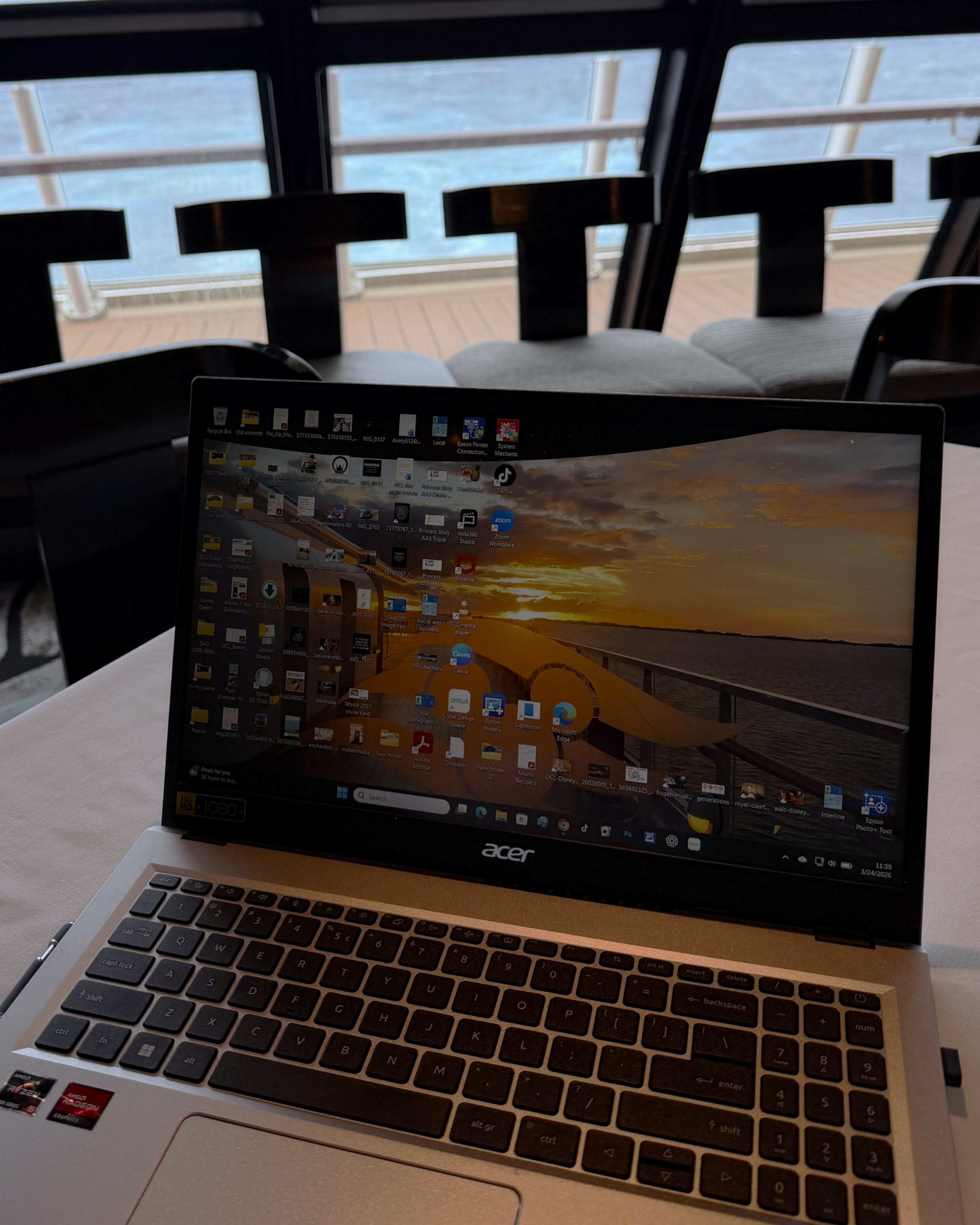 Laptop set up on a cruise ship with ocean view in the background