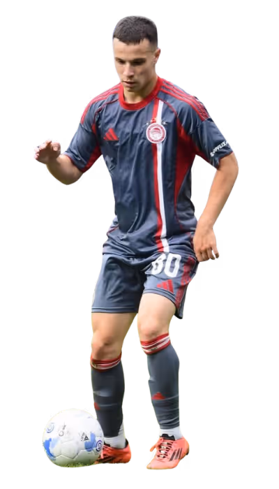 Male soccer player in gray and red uniform controlling a white soccer ball with his foot.