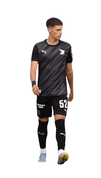 Male soccer player wearing a black jersey and shorts with the number 52, walking and looking to his left.